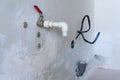 Temporary white plastic tap during the repair and installation of sewage pipes in the apartment