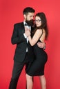 Temptation. sexy couple in love. formanl couple in tuxedo and black dress. elegant fashion and beauty. romantic date