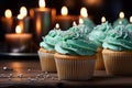 Tempting birthday treat Cupcake with blue candle, heart, and green crown cupcakes