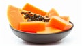 Tempting Close-up: Vibrant Papaya Slices Exquisitely Set in a Petite Bowl, Isolated on a Crisp White Royalty Free Stock Photo