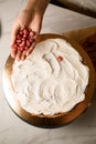 Whipped cream and frozen strawberries on cake. Tempting dessert