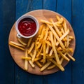 Tempting fries paired perfectly with a basket of ketchup