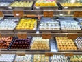 Tempting Indian sweets arranged for display and sale at a city sweet shop