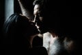 Tempting kiss. Sensual couple in love. Romantic couple in love looking at each other closeup. Man embracing and going to
