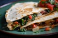 tempting macro shot of a vegetarian quesadilla stuffed with sauteed mushrooms, spinach, and onions