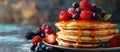 Delicious Pancakes Topped With Berries and Syrup Royalty Free Stock Photo