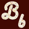 Tempting typography. Font design. 3D letter B of the whipped cream and candy