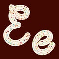 Tempting typography. Font design. 3D letter E of the whipped cream and candy