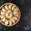 Tempting top view savory cabbage dumplings on dark background