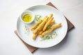 tempura-battered baby corn on a stripe plate