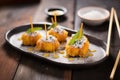 tempura cheesecake bites with powdered sugar