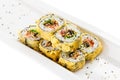 Tempura maki sushi - deep fried hot sushi roll with salmon, tuna Royalty Free Stock Photo