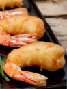 Tempura prawns on black plate. Royalty Free Stock Photo