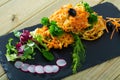 Tempura vegetables with greens, radish, black olives Royalty Free Stock Photo