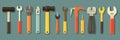 Array of Various Hand Tools Including Hammers, Wrenches, and Screwdrivers Arranged Side by Side Against a Solid Blue Royalty Free Stock Photo