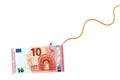 Ten euro banknote on glossy silver metal fishing hook on a rope on white