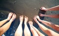 Ten feet of a family of five barefoot people on the seashore Royalty Free Stock Photo