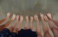 Ten feet of a family of five person on the beach Royalty Free Stock Photo