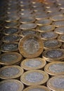 Ten Mexican pesos coin over more coins aligned and stacked Royalty Free Stock Photo