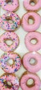 Ten pink donuts