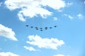 Ten planes in a blue sky with clouds on a Sunny day. like a bird Royalty Free Stock Photo