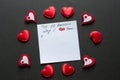 Ten reasons why I love you. Valentine's day background. Frame of red hearts around white paper on black