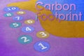 Ten steps to reduce your Carbon Footprint - concept with numbers game from 1 to 10 in a outdoors children`s playground