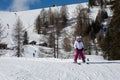 Ten Year Little Skier Having Fun skiing in Italian Dolomites Alps Mountains