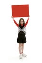 Ten year old caucasian girl dressed as a red cheerleader outfit on white background Royalty Free Stock Photo