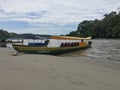 Tena, Ecuador - 29-9-2019: large elongated canoes used to guide tourist over a large tropical river