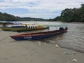 Tena, Ecuador - 29-9-2019: large elongated canoes used to guide tourist over a large tropical river