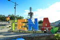 Tena, written in letters and put on the main plaza in tena with in the back the espiral