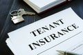 Tenant insurance policy, key and pen Royalty Free Stock Photo