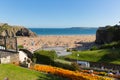 Tenby Pembrokeshire Wales uk castle beach in summer with tourists and visitors and blue sky