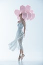 tender ballet dancer in white dress with pink balloons Royalty Free Stock Photo