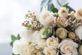 Tender beautiful wedding bouquet closeup, peach color roses and decoration, selective focus