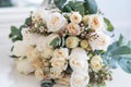 Tender beautiful wedding bouquet closeup, peach color roses and decoration, selective focus