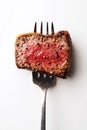 Tender beef slice cut out and isolated on a transparent background, positioned on a fork, for stock culinary image use Royalty Free Stock Photo