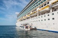 Tender boat tender transporting passenger from the shoreline to cruise ship in Phuket, Thailand Royalty Free Stock Photo