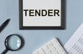 Tender, business word on office desk. Offer