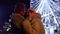 Tender couple kissing at night city. Man and woman hugging on urban street. Royalty Free Stock Photo