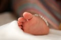 Tender cute foot of a just born baby