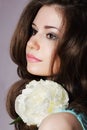 Tender Daydreaming Girl with White Peony Closeup