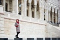 Tender female smiling standing against architecture of city at Budapest