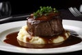 tender filet mignon on a bed of mashed potatoes with gourmet sauce