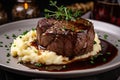 tender filet mignon on a bed of mashed potatoes with gourmet sauce