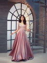 Tender gorgeous graceful lady at vintage stairs, girl in long gorgeous pink tender dress with sparkles, attractive