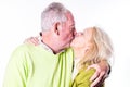 Tender Kiss Between Loving Senior Couple Royalty Free Stock Photo