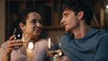 Tender lovers enjoy wine at home late evening closeup. Couple romantic date. Royalty Free Stock Photo