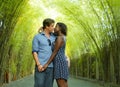 Tender mixed ethnicity couple cuddling outdoors with attractive black afro American woman and handsome Caucasian boyfriend or Royalty Free Stock Photo